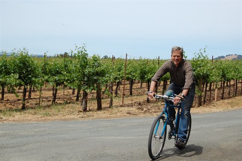 Parke riding his bike to work